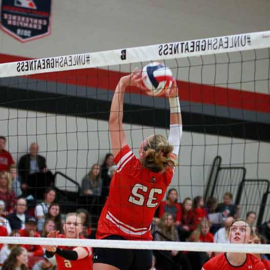 A Benedictine College Volleyball player setting the ball